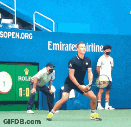 Man Playing Tennis In Front Of Emirates Ad GIF