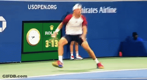 Man Playing Tennis In Front Of Emirates Ad GIF