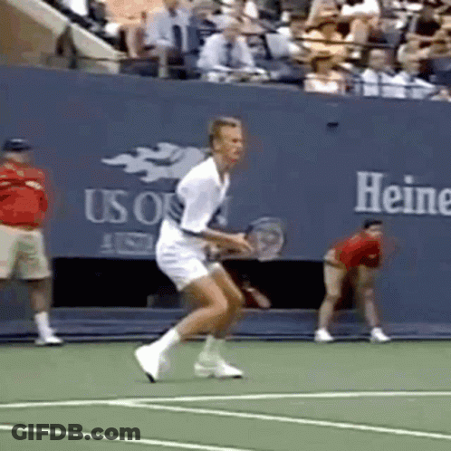 Man Playing Tennis In Front Of Heine Wall GIF