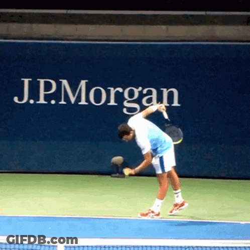 Man Playing Tennis In Front Of J.P. Morgan Ad GIF