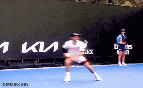 Man Playing Tennis In Front Of Kia Sign GIF