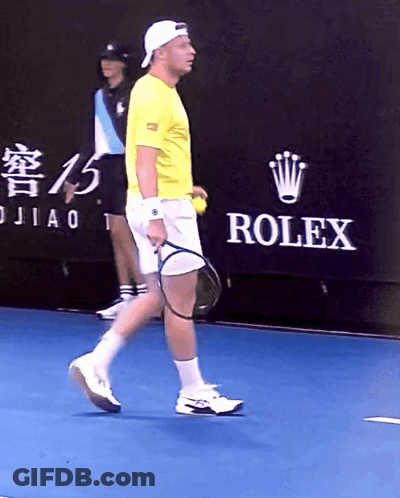 Man Playing Tennis In Front Of Rolex Banner GIF