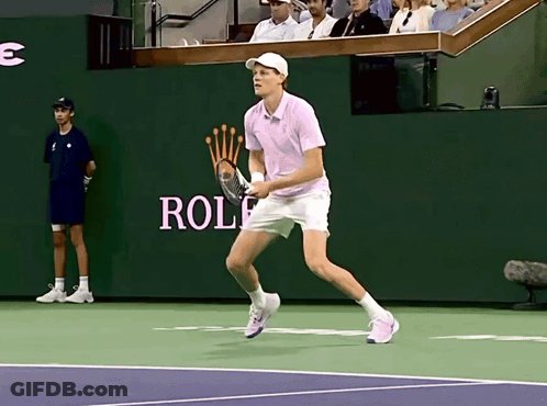 Man Playing Tennis In Front Of Rolex Wall GIF