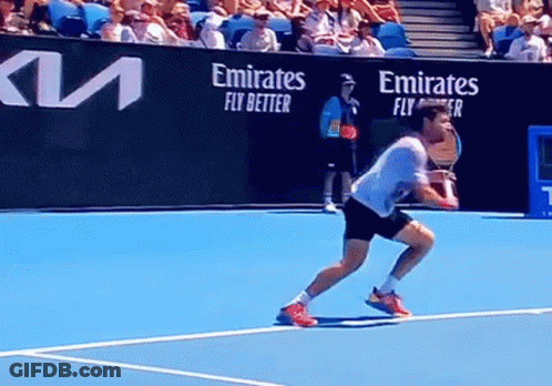 Man Playing Tennis On Court With Emirates Fly Better GIF