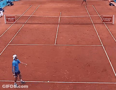 Man Playing Tennis With Mutua Madrilena Banner GIF