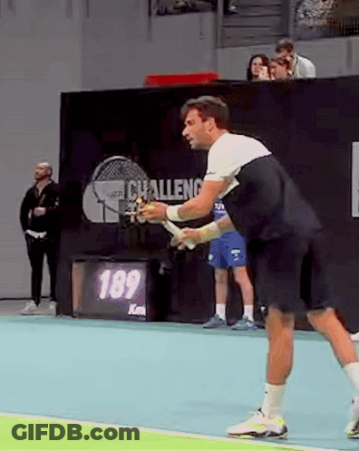 Man Playing Tennis With Racquet GIF