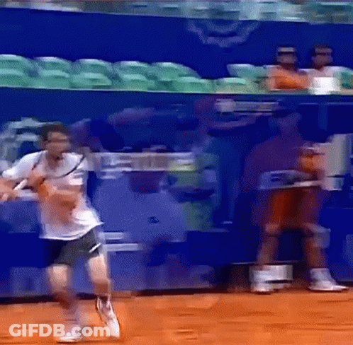 Man Playing Tennis With Watching Crowd GIF