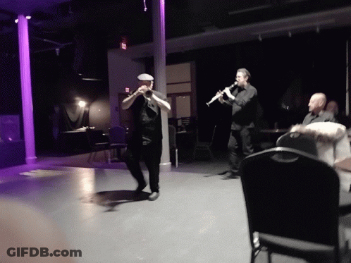 Man Playing Trumpet And Clarinet GIF