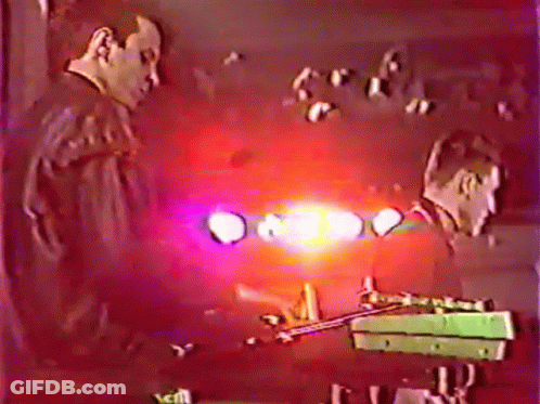 Man Playing Trumpet In Front Of Crowd GIF