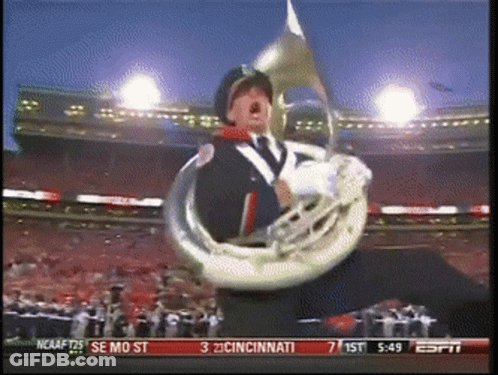 Man Playing Trumpet In Stadium Score 3 To 2 GIF
