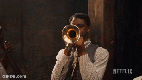 Man Playing Trumpet With Netflix Logo GIF