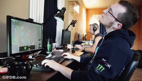 Man Playing Video Game With Headphones GIF