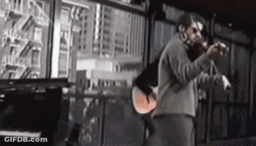 Man Playing Violin In Front Of Piano And Window GIF