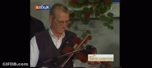 Man Playing Violin In Front Of Sign Kuogn GIF