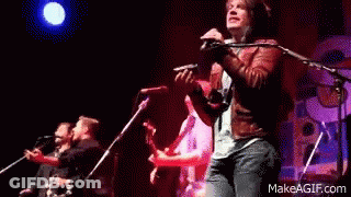 Man Playing Violin Singing On Stage GIF