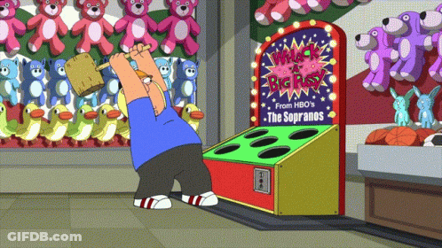 Man Playing Whack A Box GIF