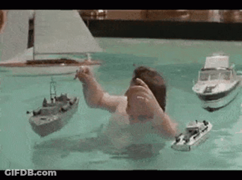 Man Playing With Boats GIF