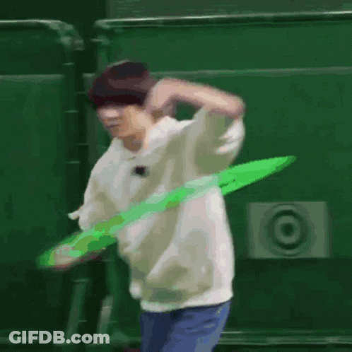 Man Playing With Green Hula Hoop GIF
