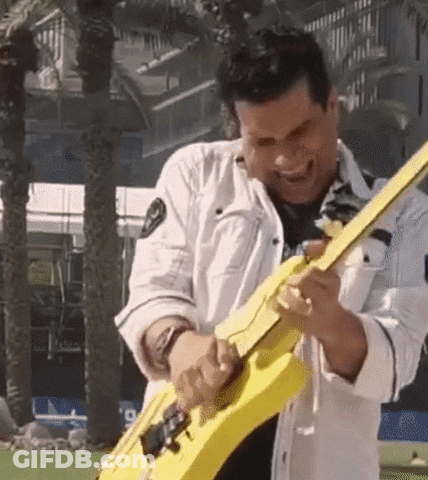 Man Playing Yellow Guitar Outdoors GIF