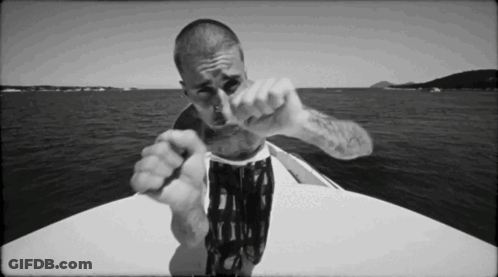 Man Pointing At Camera On Boat GIF