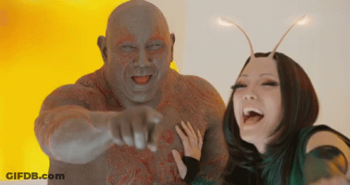 Man Pointing At Camera Posing With Woman GIF
