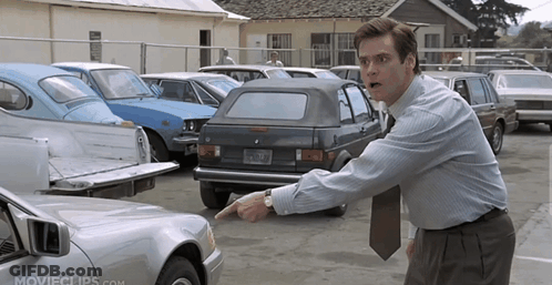Man Pointing At Car In Parking Lot GIF