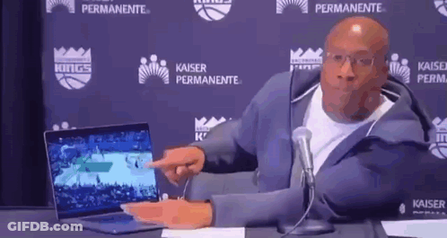 Man Pointing At Laptop In Front Of Microphone GIF