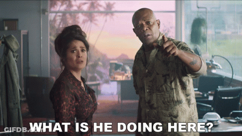 Man Pointing At Woman Asking What Is He Doing Here GIF