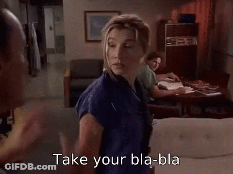Man Pointing At Woman In Kitchen GIF
