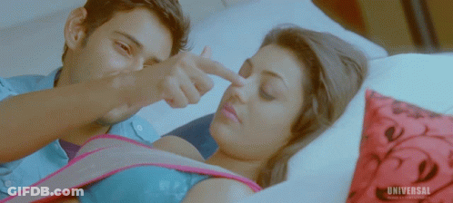 Man Pointing At Woman's Nose With Universal Logo GIF