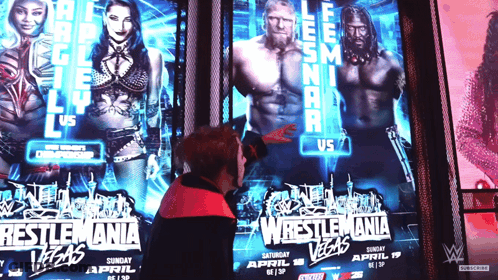 Man Pointing At Wrestlemania Poster In Las Vegas GIF