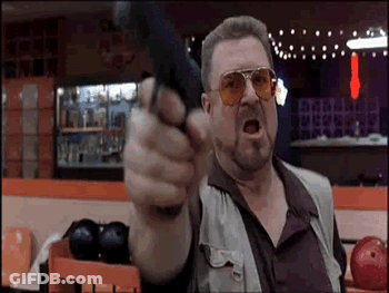 Man Pointing Gun At Camera In Bowling Alley GIF
