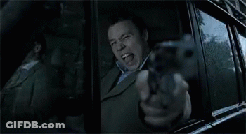 Man Pointing Gun Out Car Window GIF