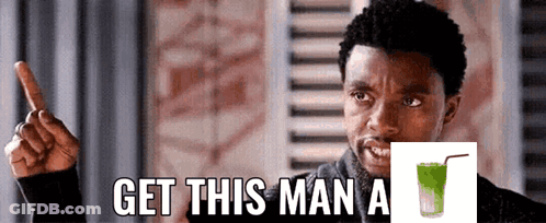 Man Pointing Up Get This Man Green Drink GIF