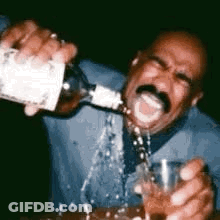 Man Pouring Alcohol Into Glass GIF