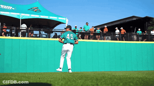 Man Pouring Beer Into Barrel While Crowd Watches GIF