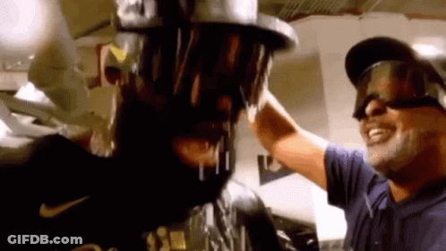 Man Pouring Beer On Another Man's Head Wearing Goggles GIF