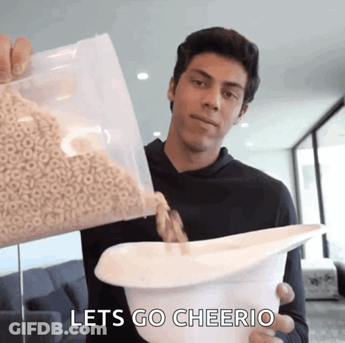 Man Pouring Cereal Saying Let's Go Cheerio GIF