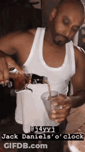 Man Pouring Drink From Bottle Into Cup GIF