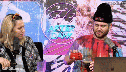 Man Pouring Drink In Front Of After Dark Sign GIF