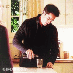 Man Pouring Drink Into Glass GIF