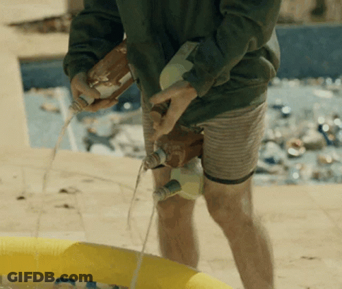 Man Pouring Liquid Into Yellow Pool GIF