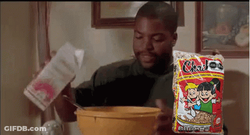 Man Pouring Milk Into Cereal Bowl Holding Bag GIF