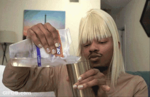 Man Pouring Water From Large Bottle Into Cup GIF
