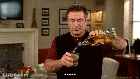 Man Pouring Whiskey From Bottle Into Glass GIF