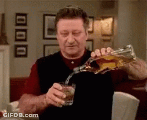 Man Pouring Whiskey Into Glass GIF