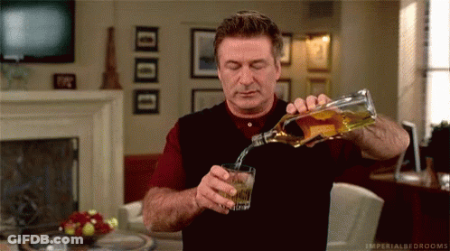 Man Pouring Whiskey Into Glass GIF