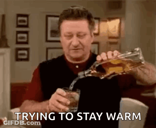 Man Pouring Whiskey Trying To Stay Warm GIF