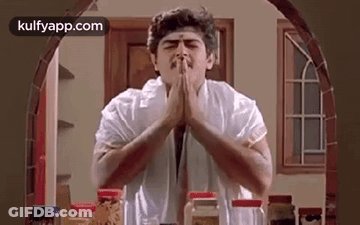 Man Praying In Kitchen GIF
