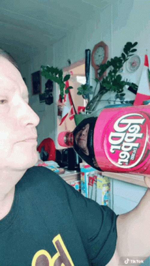Man Pretending To Eat Dr Pepper Bottle GIF